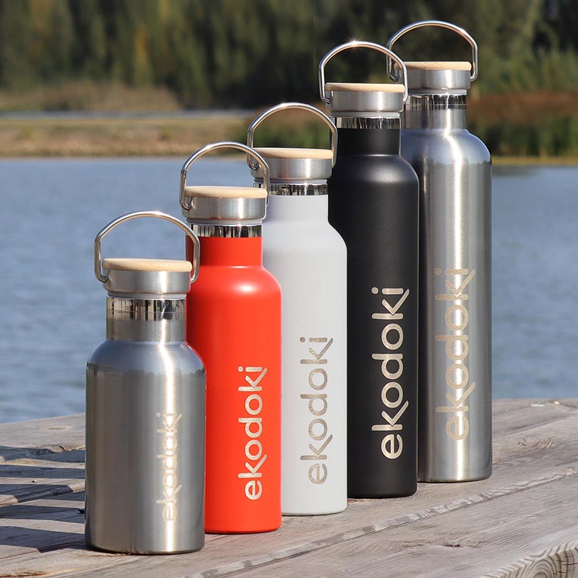 five stainless steel thermos bottles from the brand eKodoKi, used to illustrate the brand's collection of stainless steel accessories