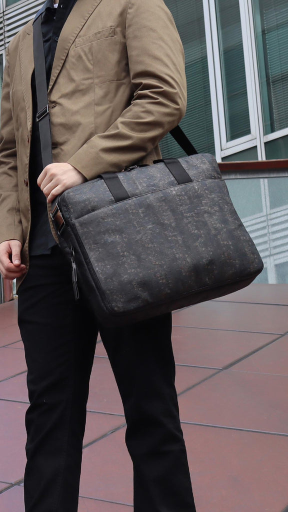 black cork & hanji briefcase from the brand eKodoKi, carried by male model, as mobile banner