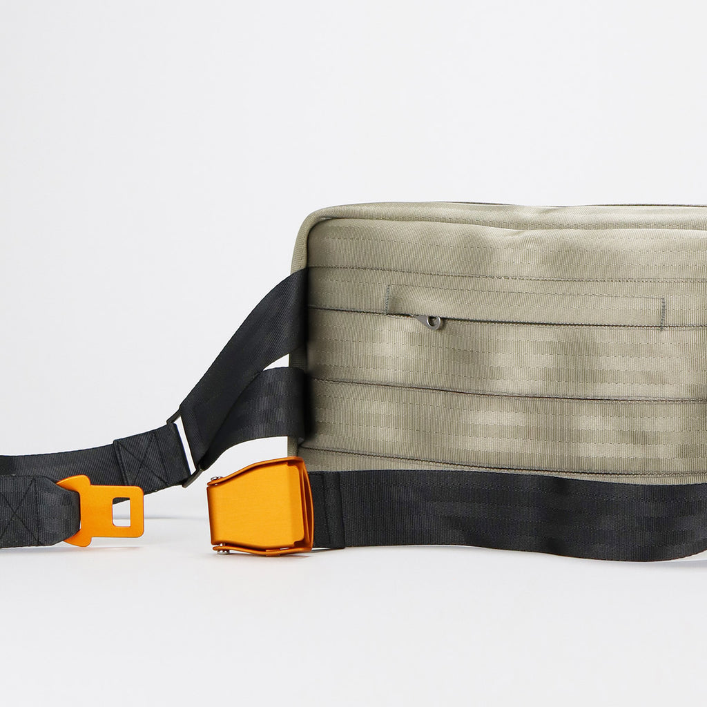 back from silver seatbelt sling bag L showing concealed pocket and orange buckle back eKodoKi RE-BELT