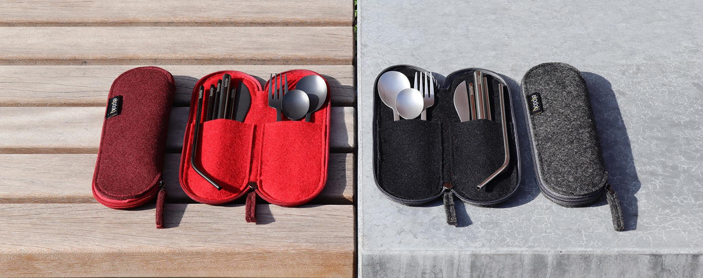 black and silver travel cutlery sets from the brand eKodoKi, in their respective red and grey wool felt cases, used as desktop banner