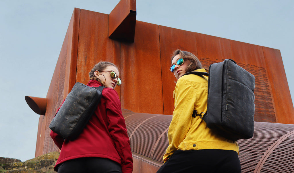 cork fabric and hanji textile bags collection home page banner showing women carrying Sling Bag and Backpack Duo eKodoKi KWORK