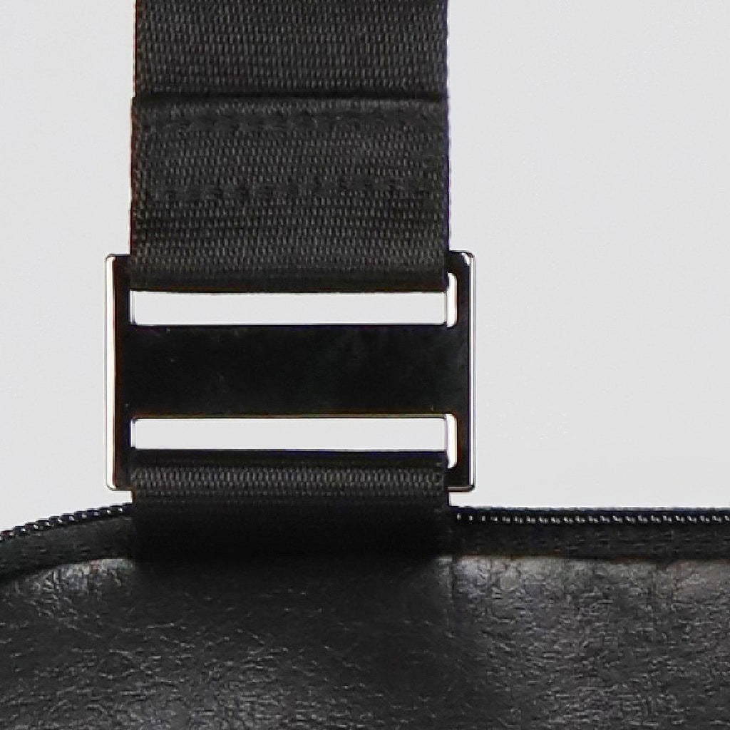 detail of a stainless steel triglide used for the assembly of the strap from the KWORK crossbody bag from the brand eKodoKi