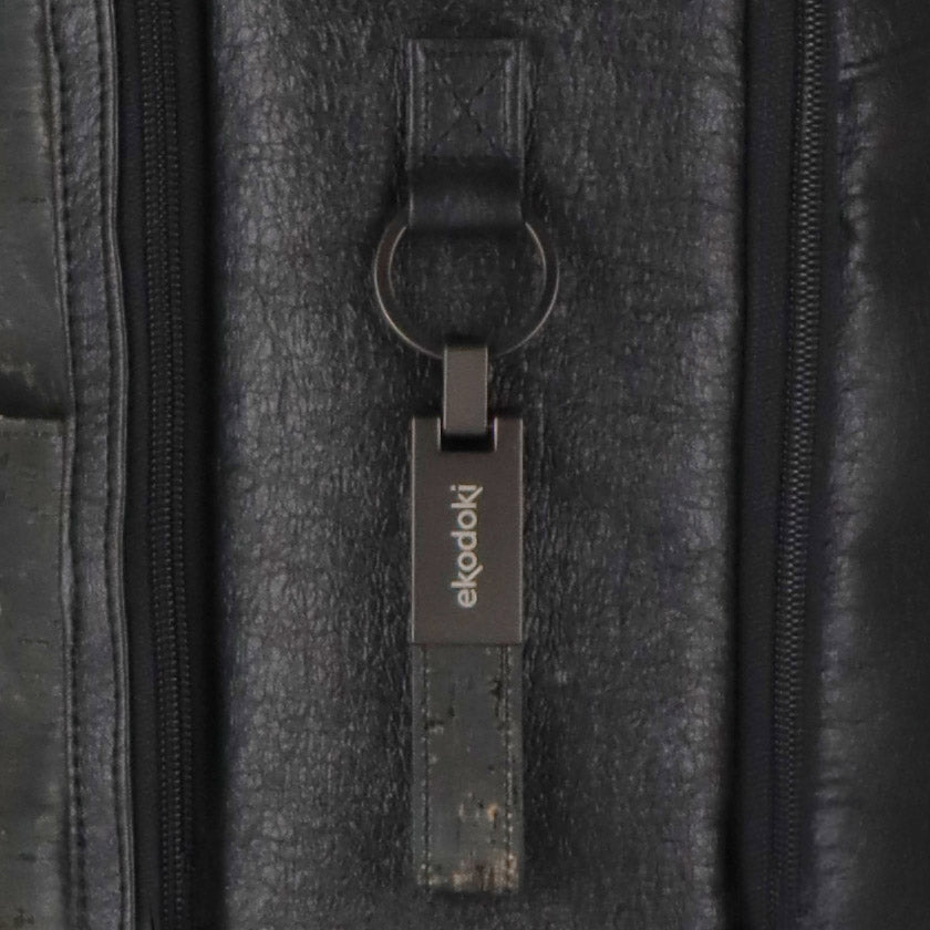 detail of an aluminium keyring used as branding on the KWORK duo backpack from the brand eKodoKi