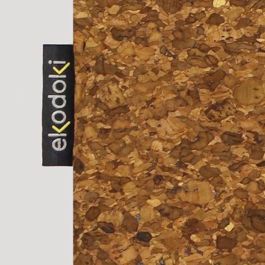 close-up detail of the branded fabric label stitched on the front of the KWORK tote bags from the brand eKodoKi