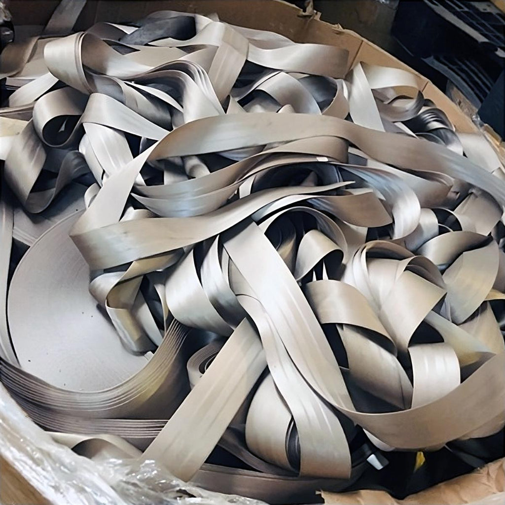 Discarded silver coloured seatbelts dumped inside a brown cardboard box