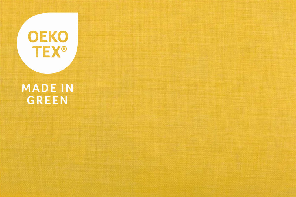 detail of golden yellow fabric showing the woven structure, overlaid with Made In Green By OEKO-tex logo