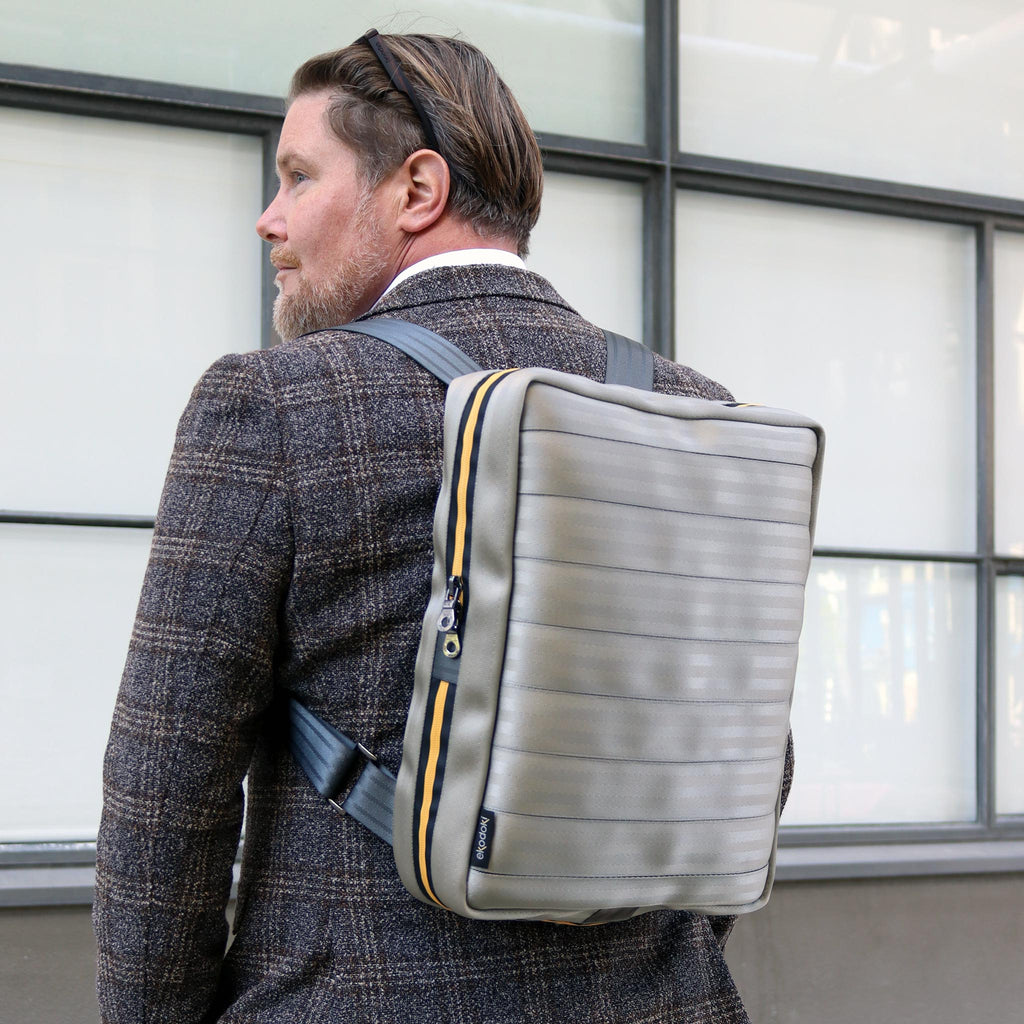 silver seatbelt backpack L on caucasian fashion model shoulders front view eKodoKi RE-BELT