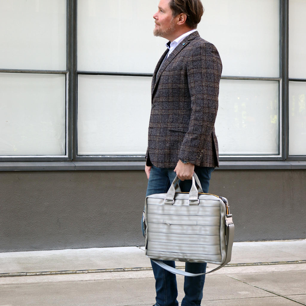 silver seatbelt briefcase L in male fashion model hand standing eKodoKi RE-BELT