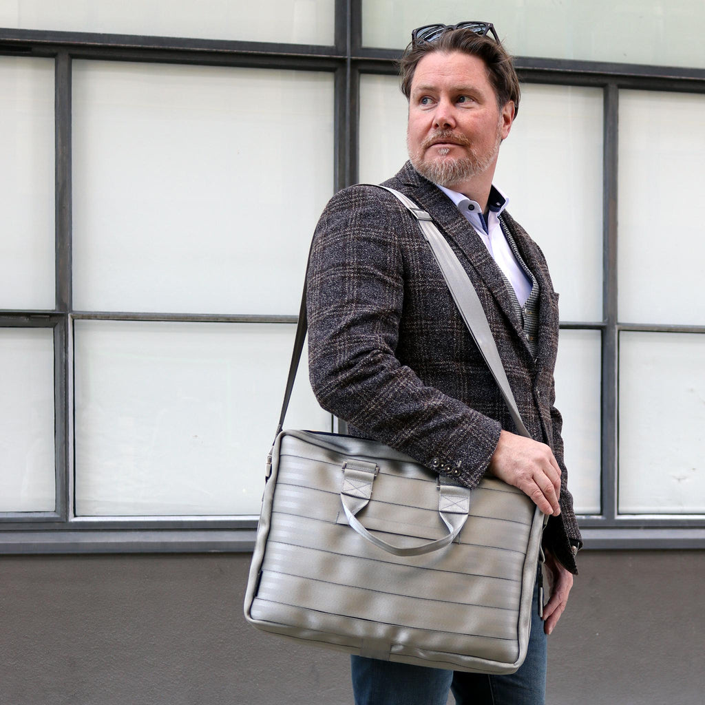 silver seatbelt briefcase L on male  fashion model shoulder crossbody standing eKodoKi RE-BELT