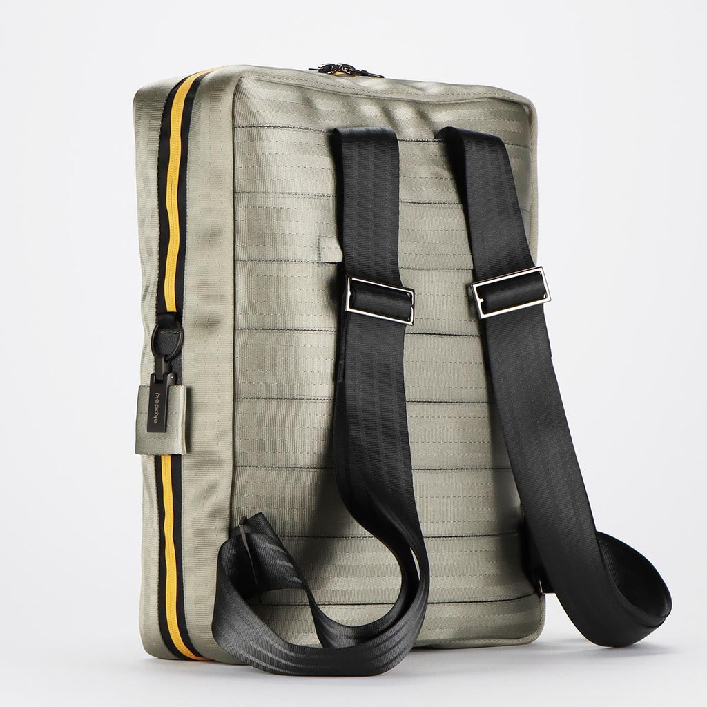 Back of silver seatbelt backpack L showing its black seatbelt straps eKodoKi RE-BELT