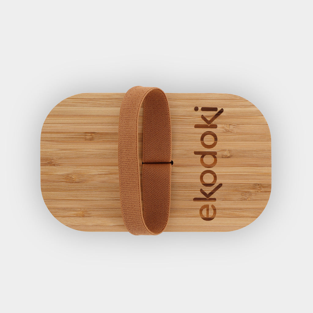 black lunchbox 1100ml 37oz with natural bamboo lid and built-in caramel elastic fabric strap off flatlay eKodoKi BENTO