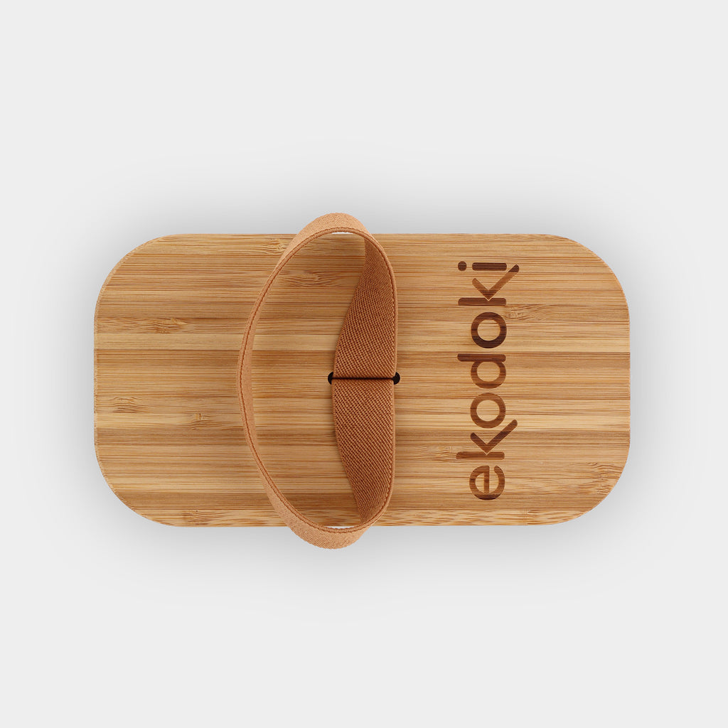 black lunchbox 700ml 24oz with natural bamboo lid and built-in caramel elastic fabric strap off flatlay eKodoKi BENTO