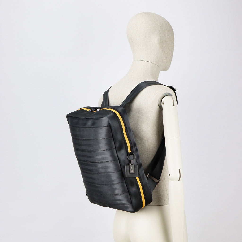 black seatbelt backpack L on male mannequin shoulders eKodoKi RE-BELT