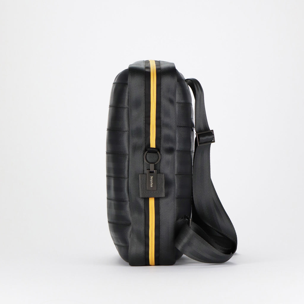 black seatbelt backpack L right side with branded keyring eKodoKi RE-BELT