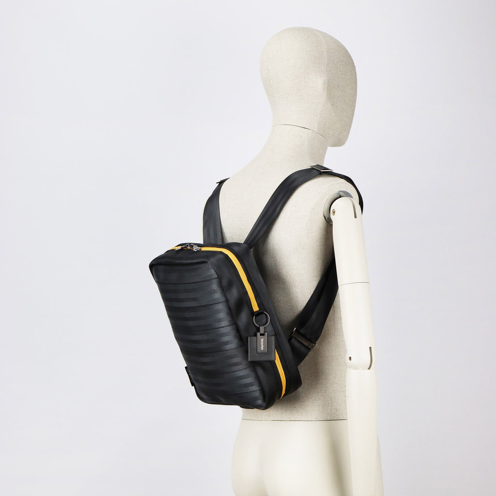 black seatbelt backpack M on male mannequin shoulders eKodoKi RE-BELT