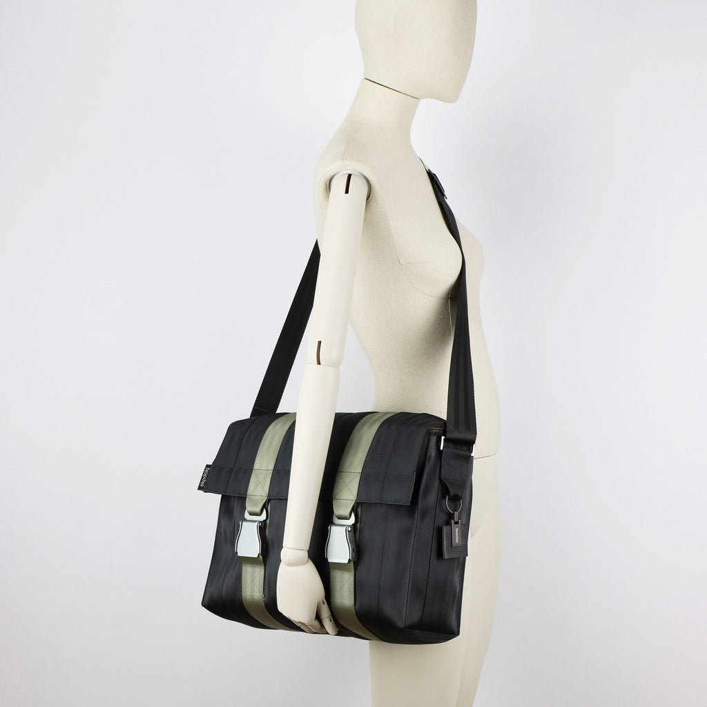 black seatbelt messenger bag L on female mannequin shoulder eKodoKi RE-BELT