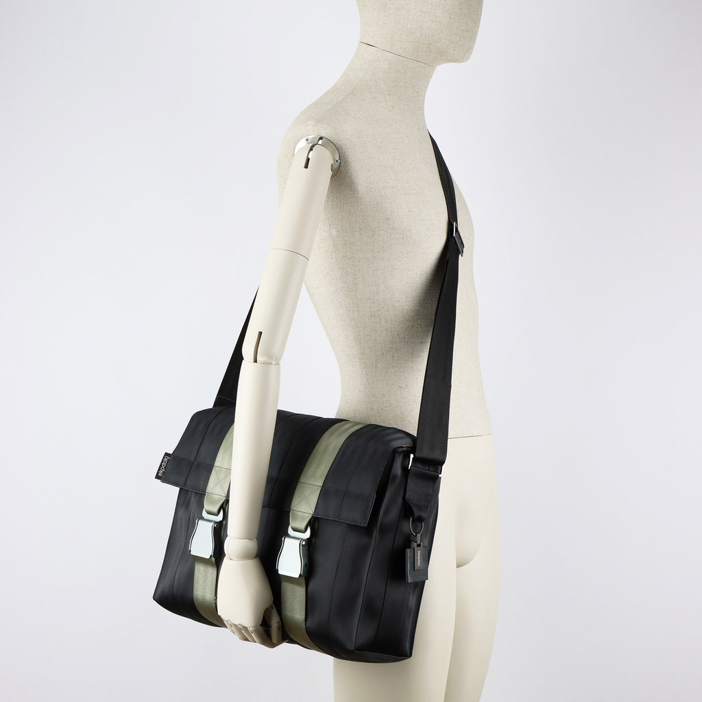 black seatbelt messenger bag L on male mannequin shoulder eKodoKi RE-BELT