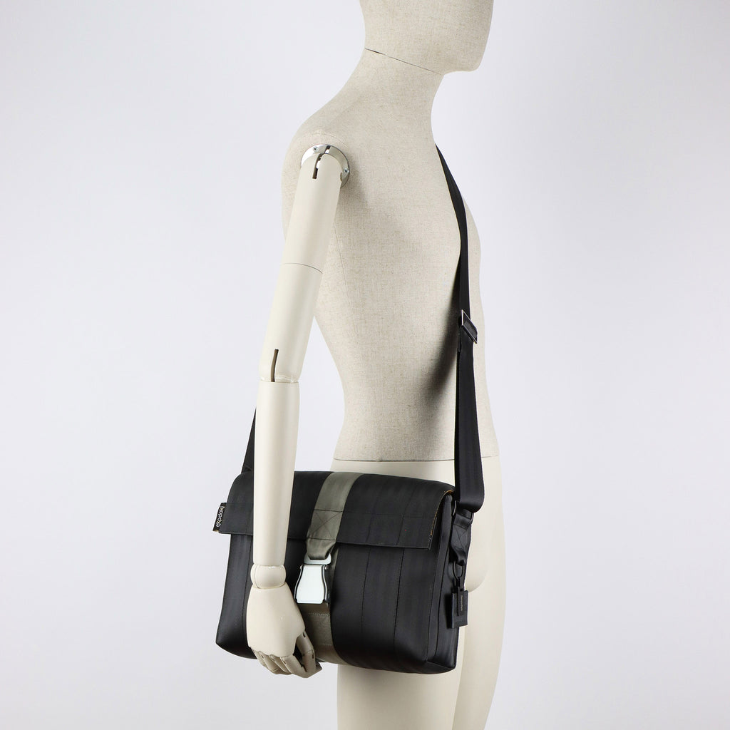 black seatbelt messenger bag M on male mannequin shoulder eKodoKi RE-BELT