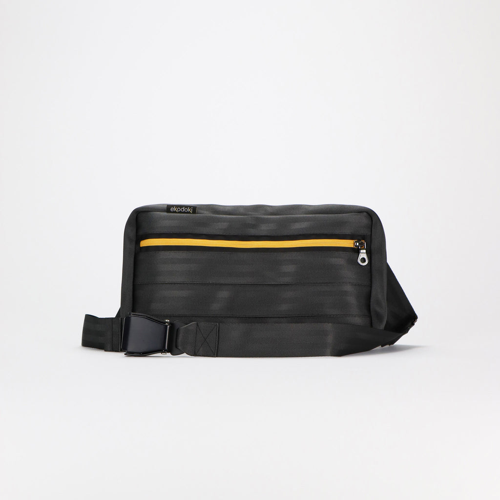 black seatbelt sling bag L featuring black buckle front eKodoKi RE-BELT