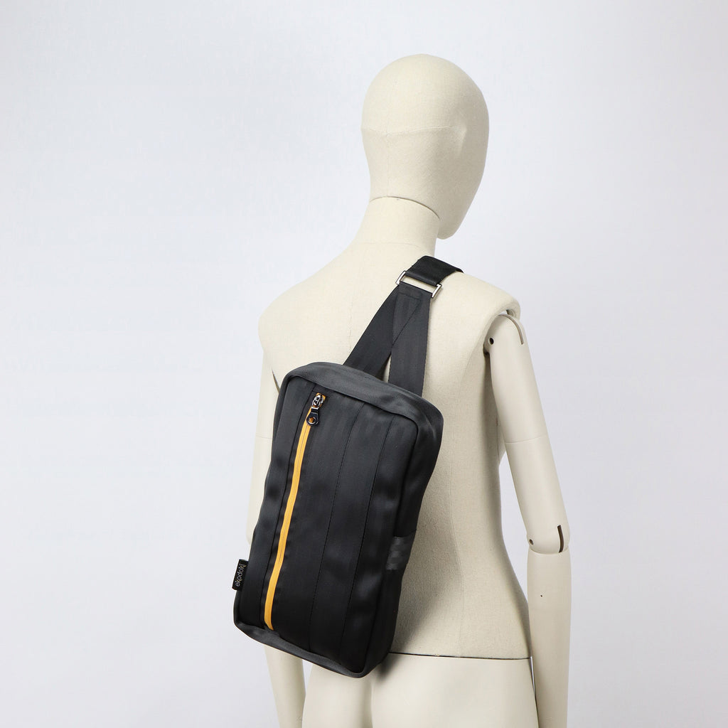 black seatbelt sling bag L on female mannequin back eKodoKi RE-BELT