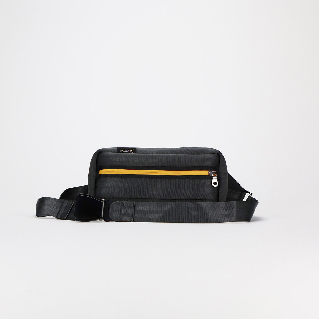 black seatbelt sling bag M featuring black buckle front eKodoKi RE-BELT