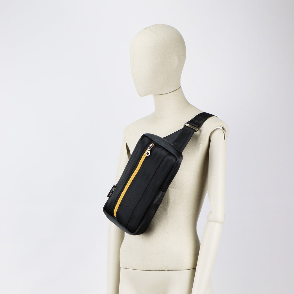 black seatbelt sling bag M on female mannequin chest eKodoKi RE-BELT