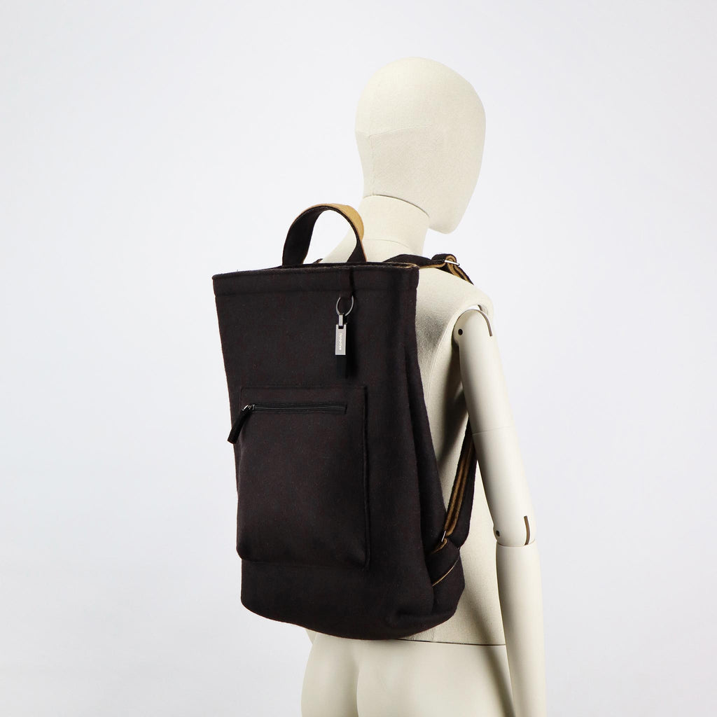 black wool felt courier backpack on female mannequin shoulders eKodoKi WOOLI