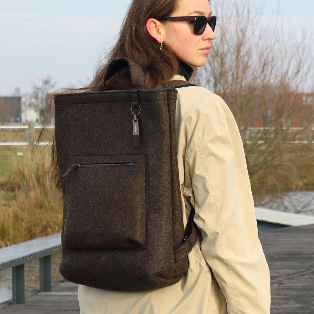 brown wool felt courier backpack on female fashion model shoulders eKodoKi WOOLI