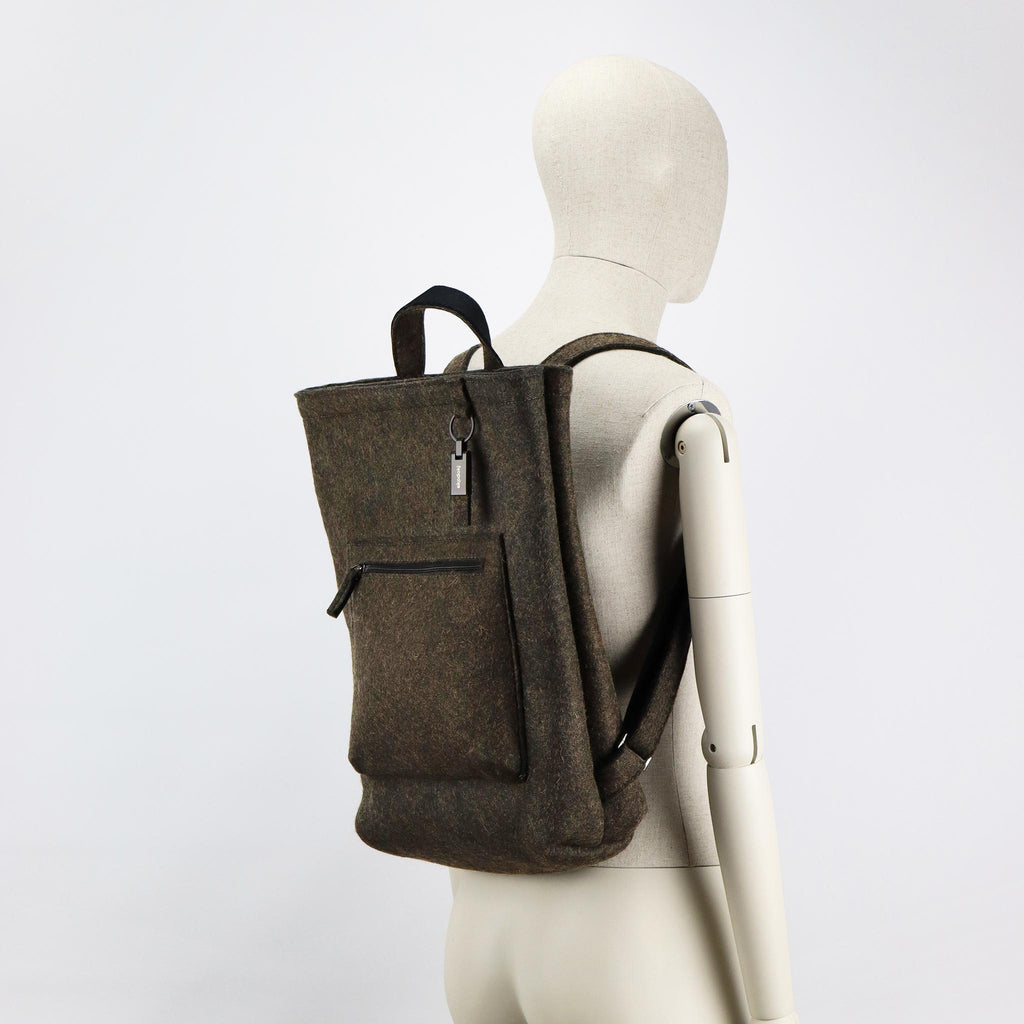 brown wool felt courier backpack on male mannequin shoulders eKodoKi WOOLI