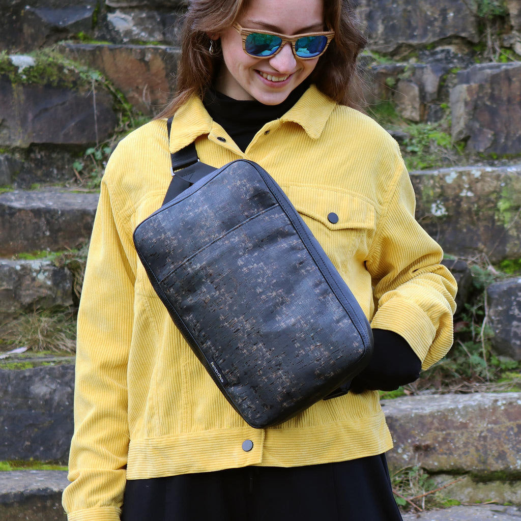 cork sling bag L black washed held by female fashion model eKodoKi KWORK
