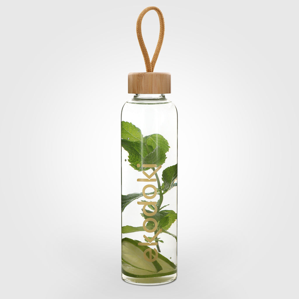 reusable glass water bottle 550ml filled with mint leaves bamboo cap closure eKodoKi HYDRO