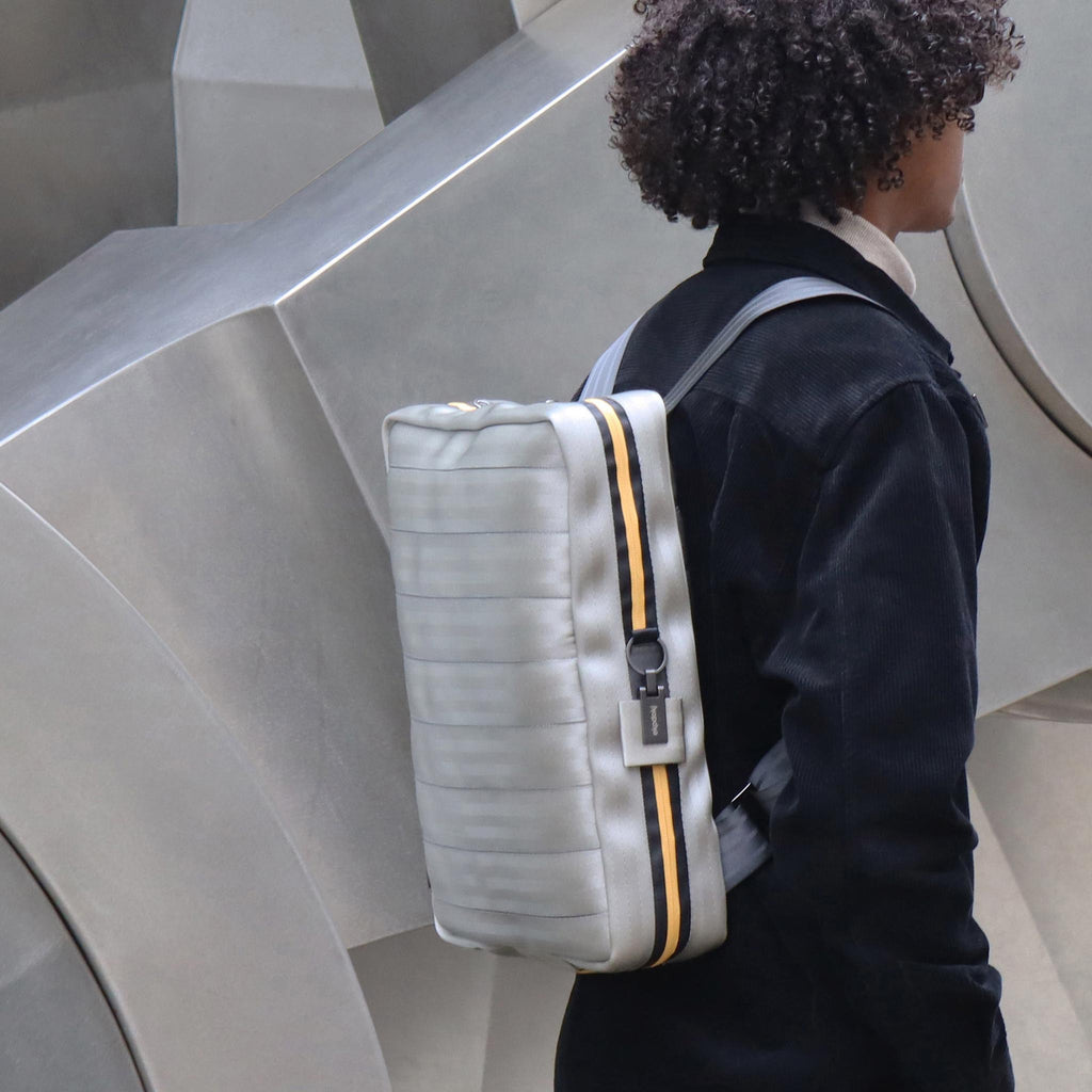 sand seatbelt backpack L on male fashion model shoulders eKodoKi RE-BELT