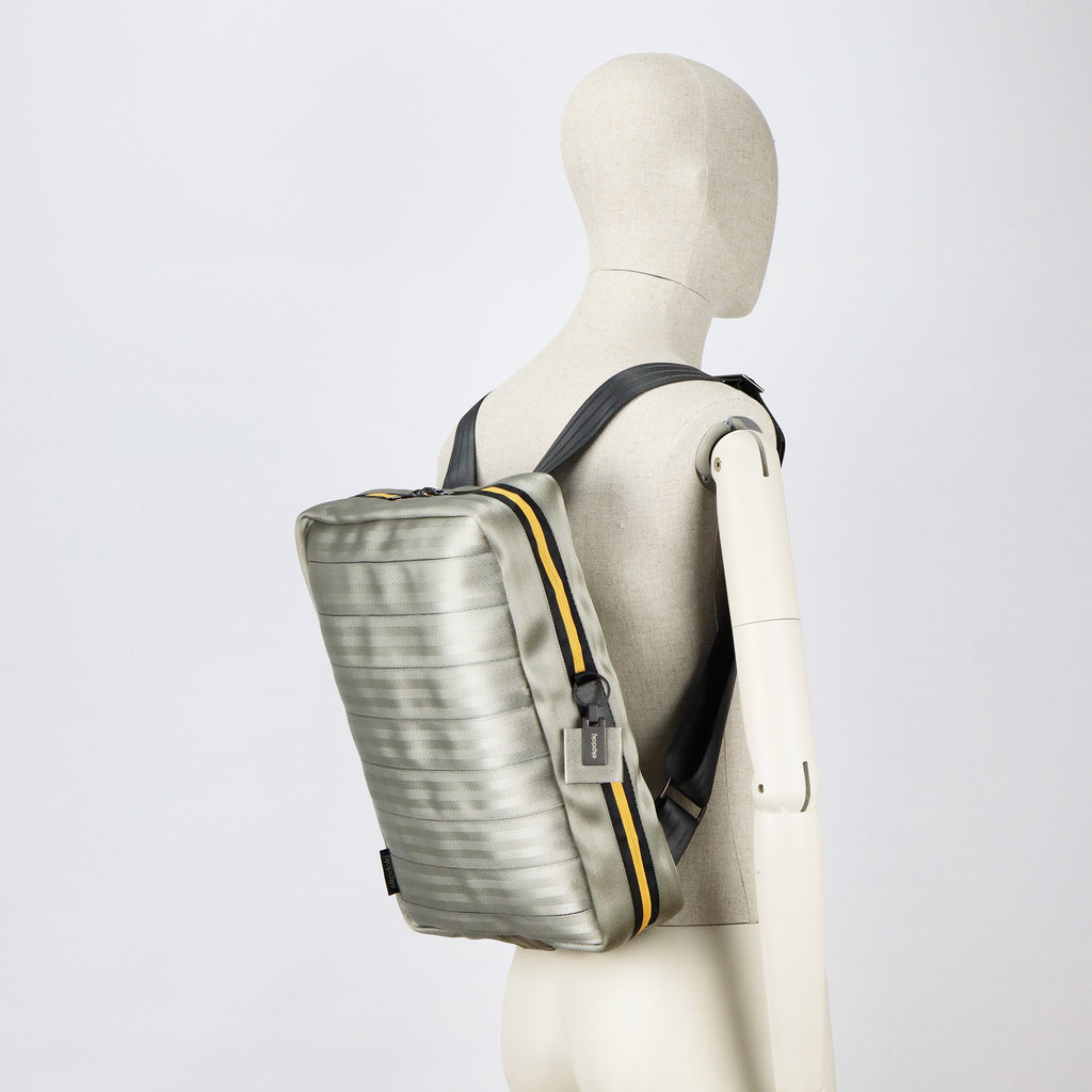 sand seatbelt backpack L on male mannequin shoulders eKodoKi RE-BELT