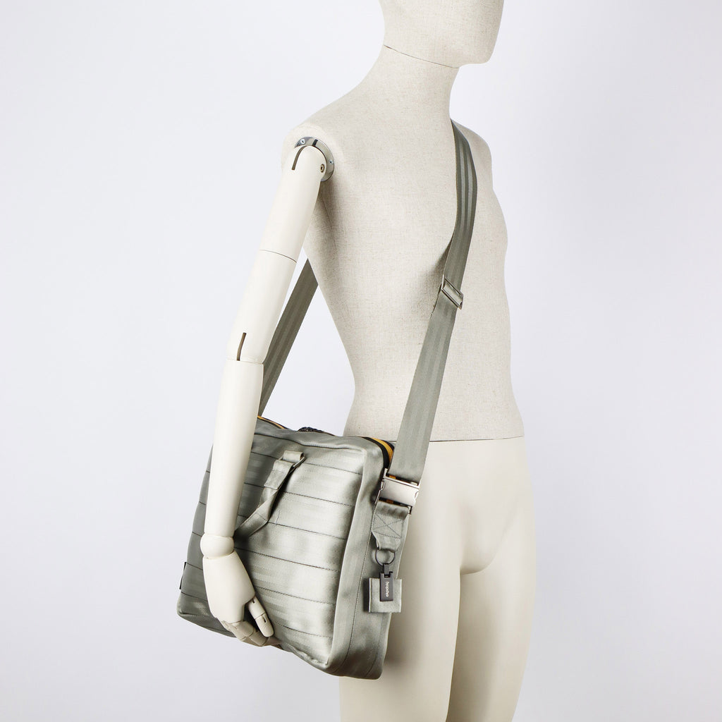 sand seatbelt briefcase L on male mannequin shoulder eKodoKi RE-BELT
