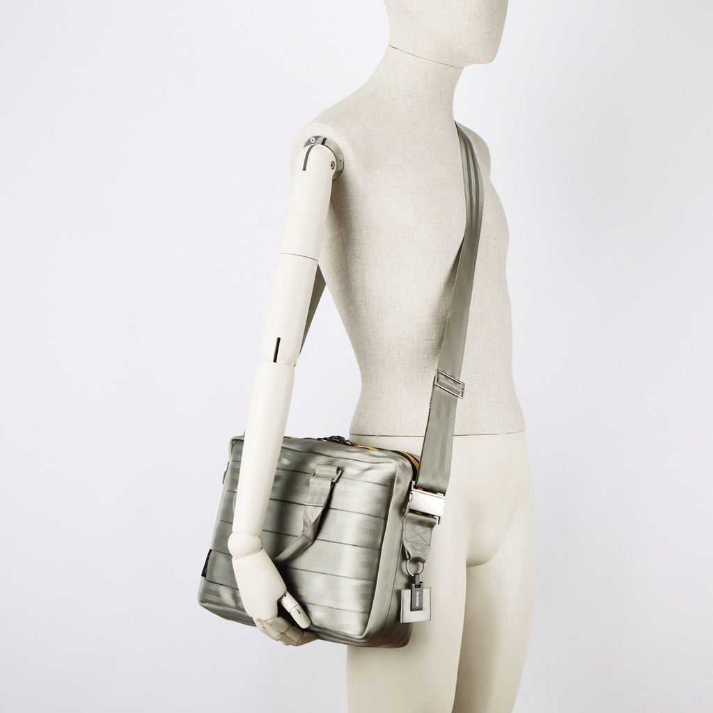 sand seatbelt briefcase M on male mannequin shoulder eKodoKi RE-BELT