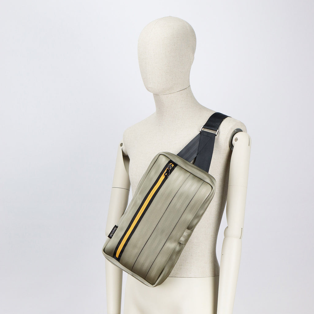 sand seatbelt sling bag L on male mannequin chest eKodoKi RE-BELT