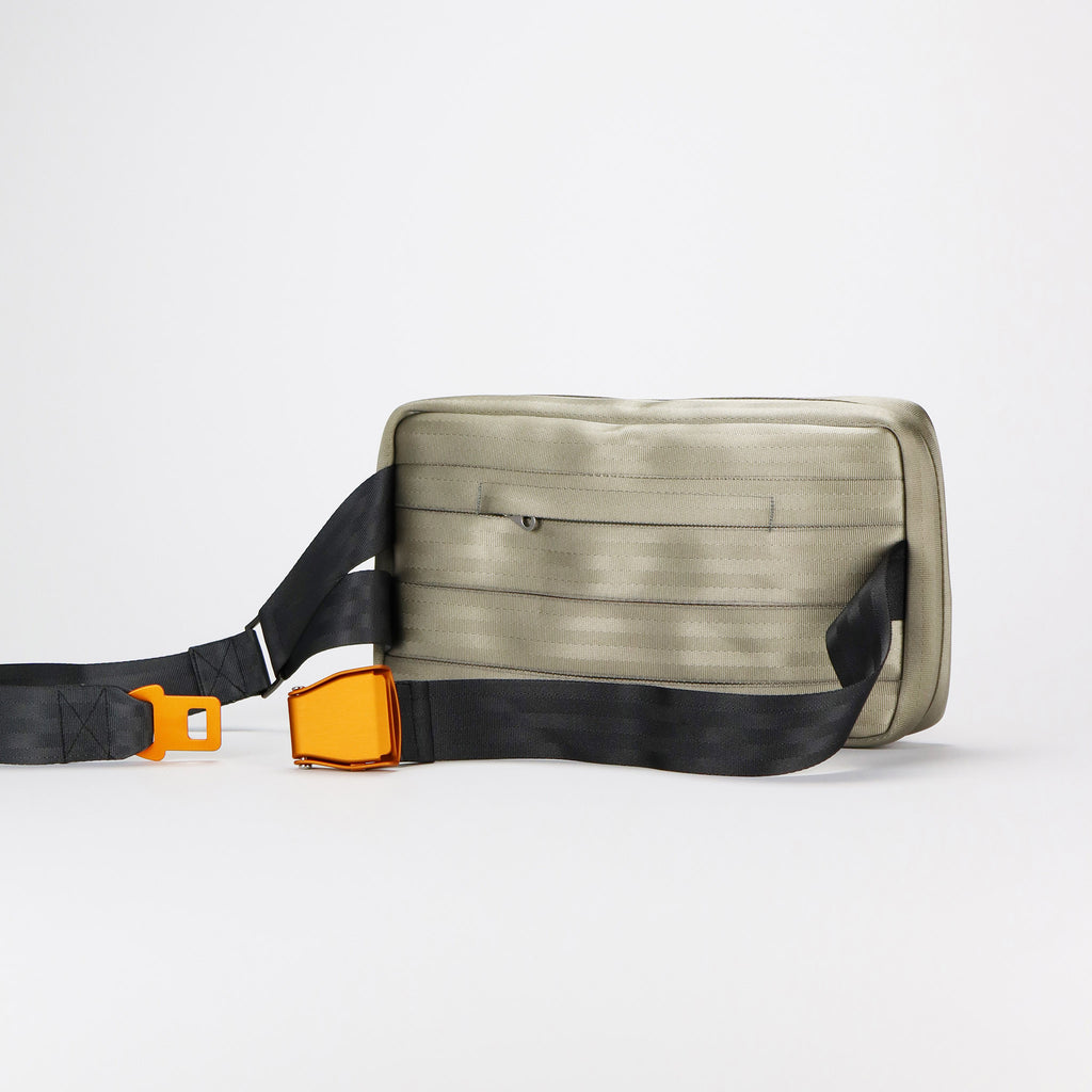sand seatbelt sling bag L featuring orange buckle back eKodoKi RE-BELT