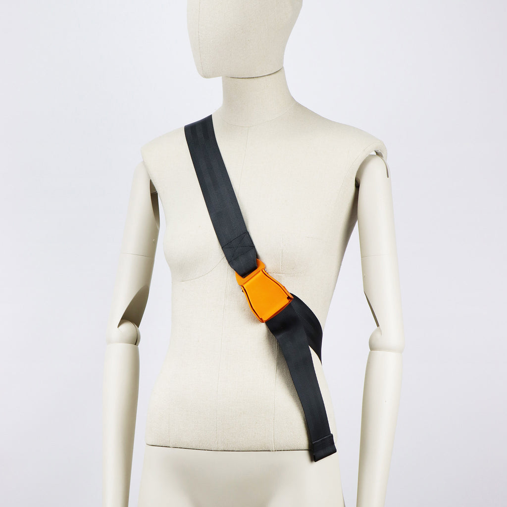 sand seatbelt sling bag L strap orange buckle on female mannequin eKodoKi RE-BELT