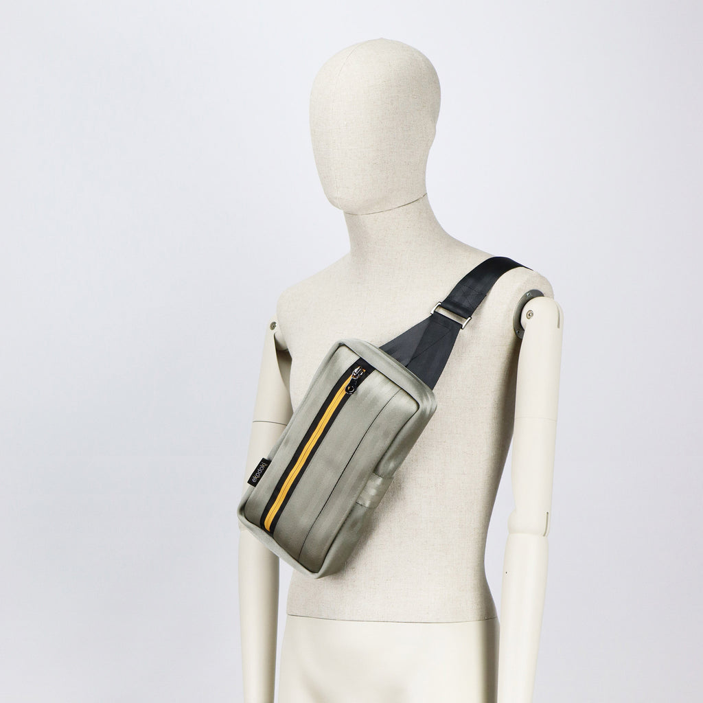 sand seatbelt sling bag M on male mannequin chest eKodoKi RE-BELT