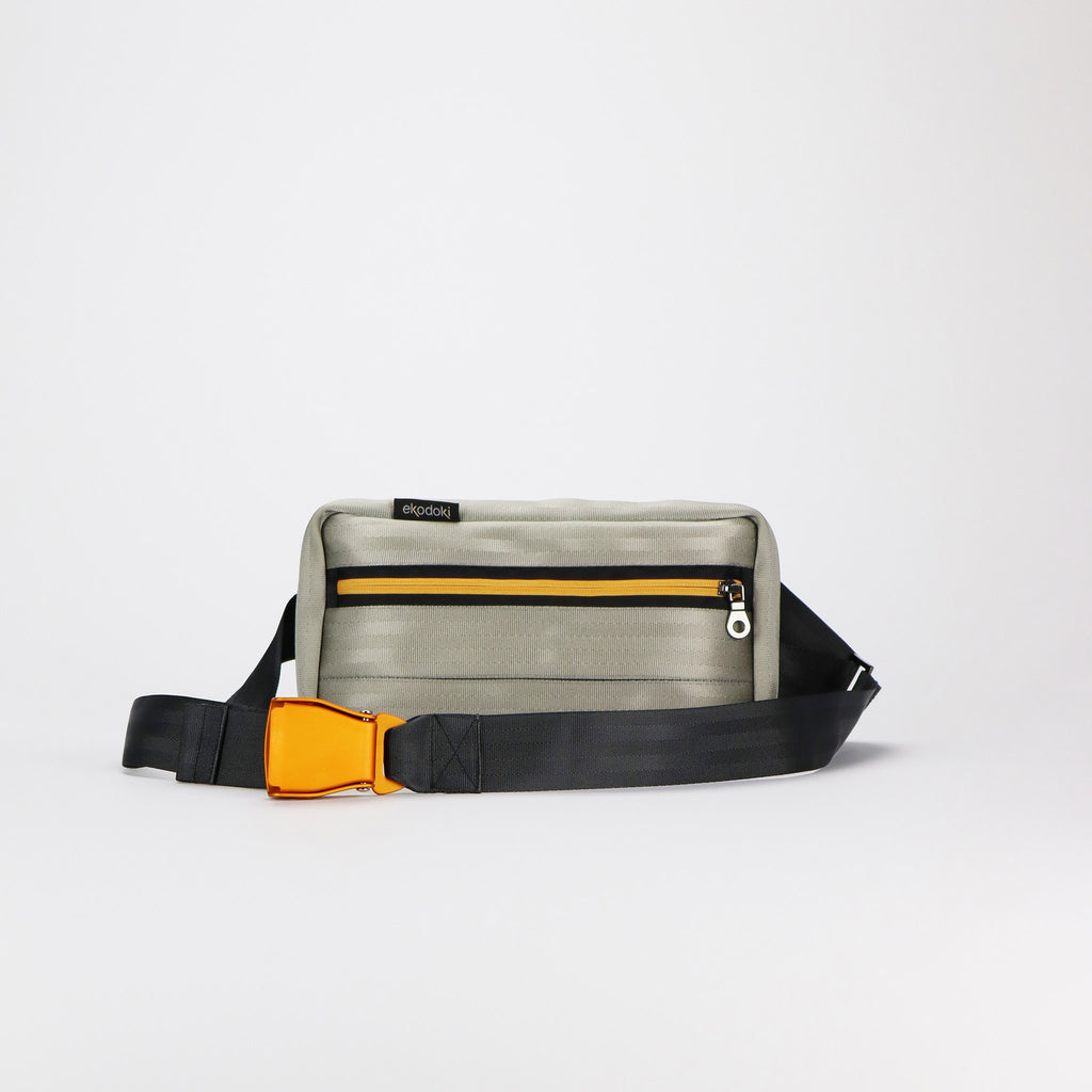 sand seatbelt sling bag M featuring orange buckle front eKodoKi RE-BELT