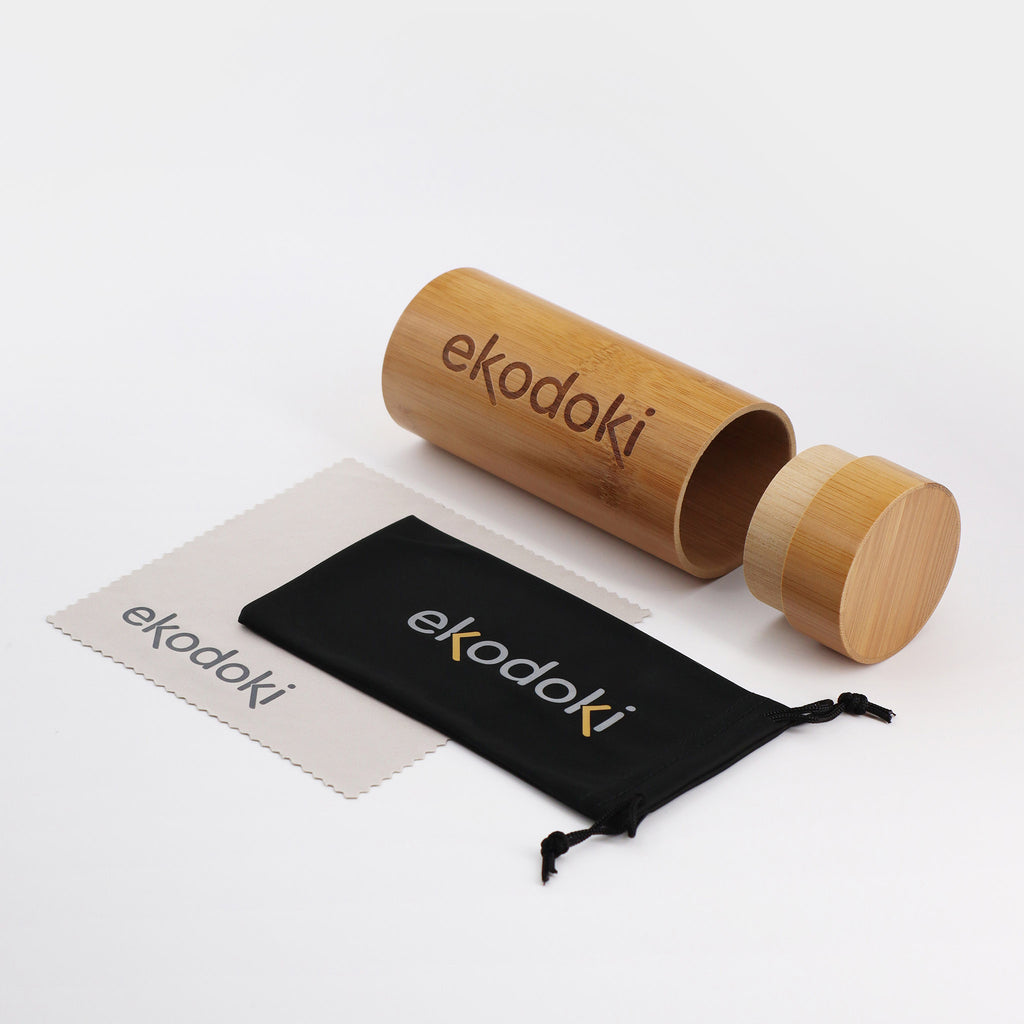 the accessories included with eKodoKi wooden sunglasses are a travel bamboo tube plus a cleaning cloth and a fabric pouch 
