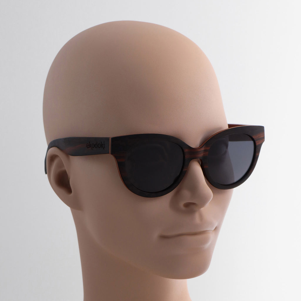wooden sunglasses cat eye style ebony wood smoke lenses on tan female mannequin head eKodoKi FELINA