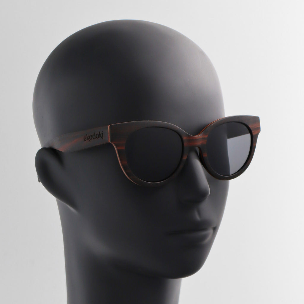 wooden sunglasses cat eye style ebony wood smoke lenses on black male mannequin head eKodoKi FELINA