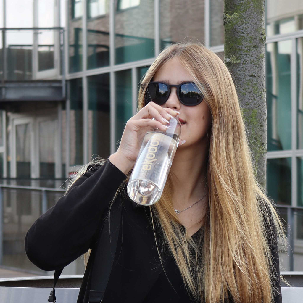 wooden sunglasses pantos style ebony wood smoke lenses on female fashion model drinking from a bottle eKodoKi COSMO