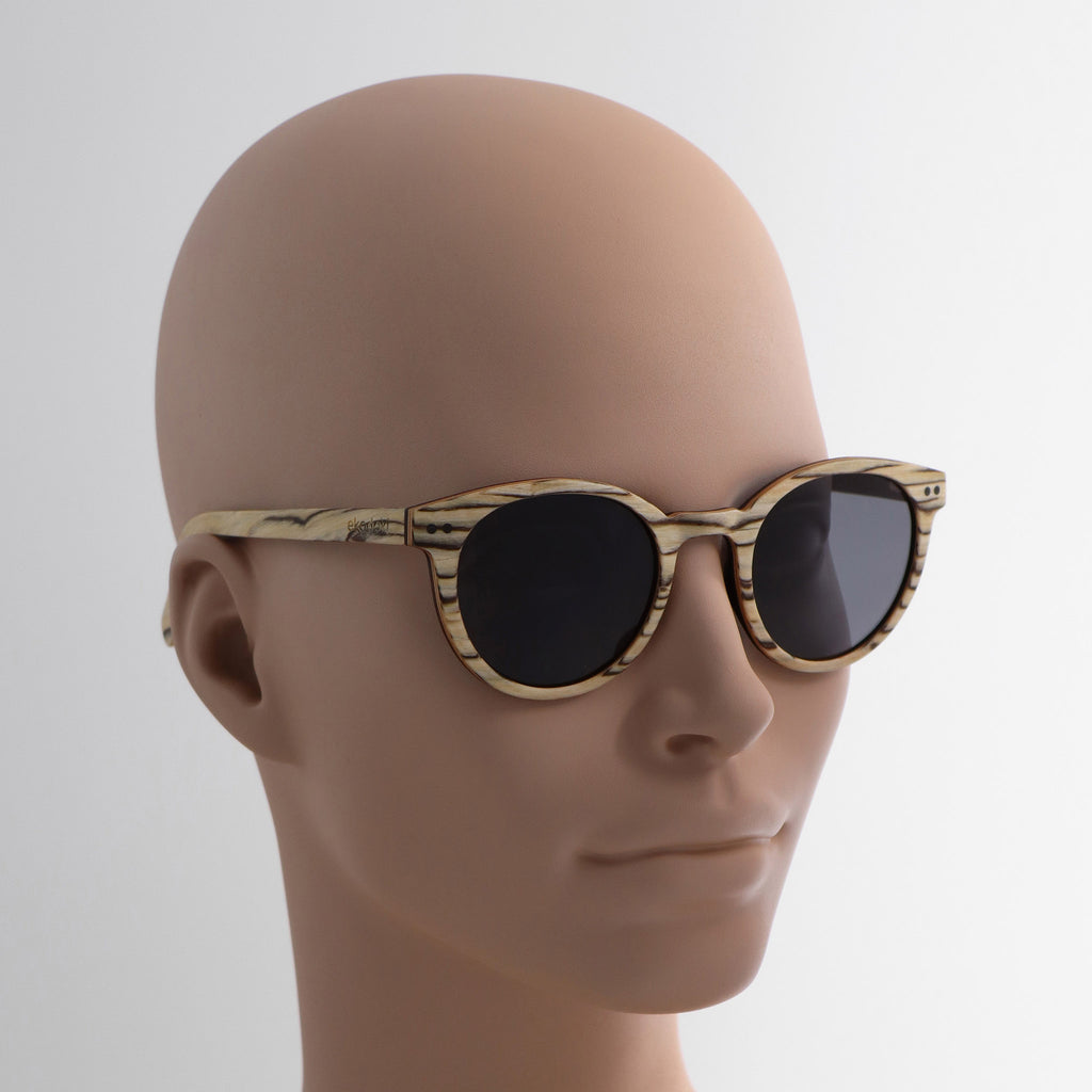 wooden sunglasses round pantos style whitewood wood smoke lenses on tan female mannequin head eKodoKi SUNDAY