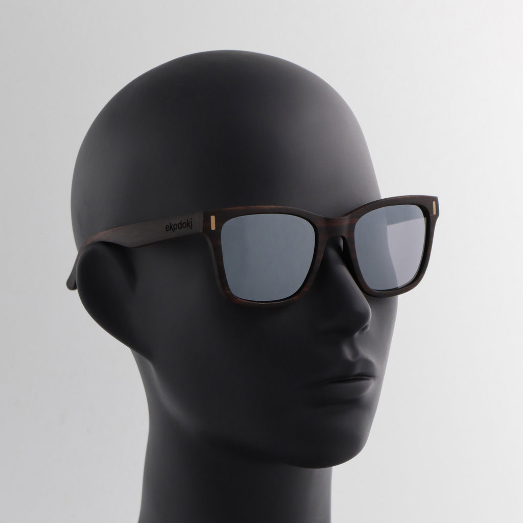 wooden sunglasses wayfarer style ebony wood silver mirror lenses on black female mannequin head eKodoKi EYE-Q