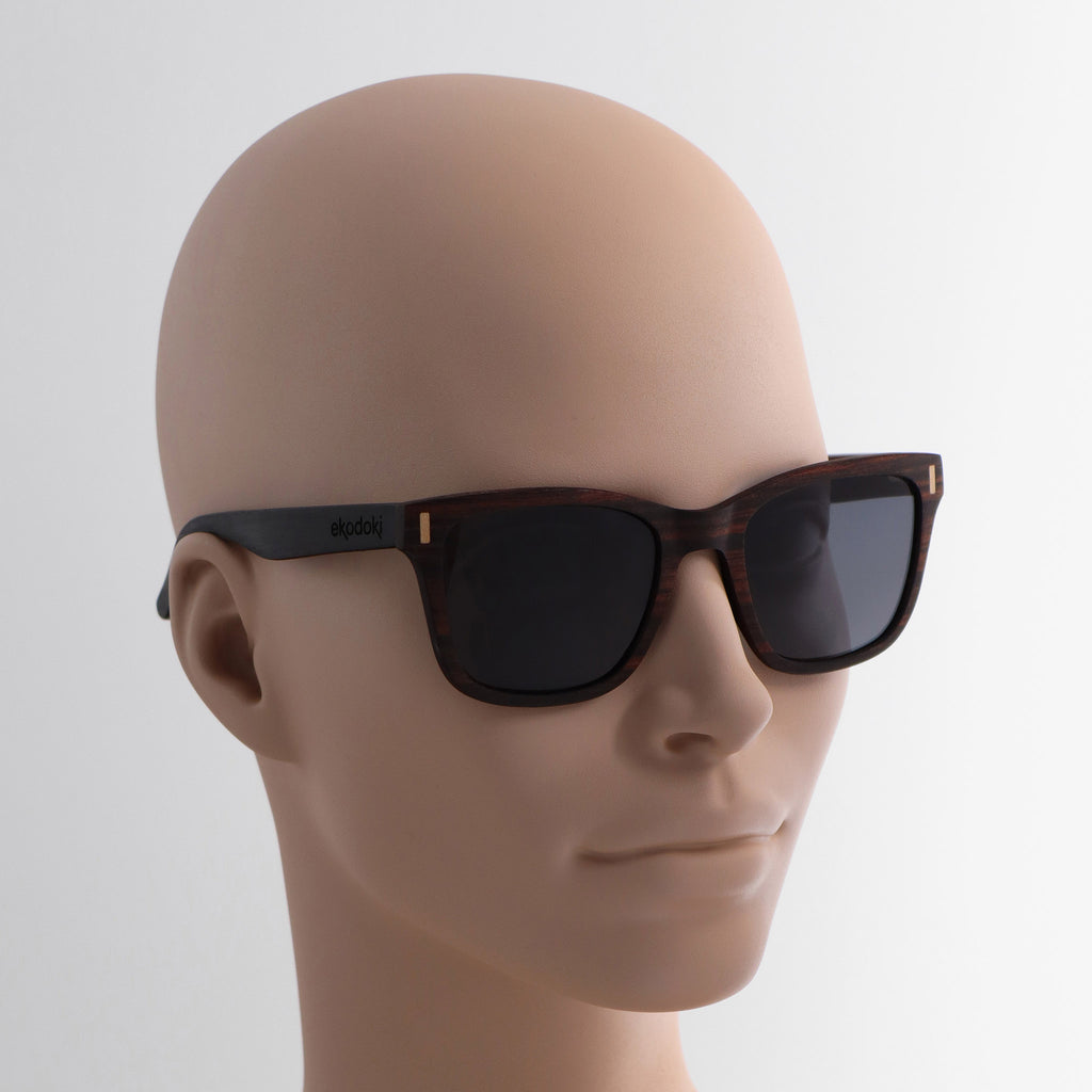 wooden sunglasses wayfarer style ebony wood smoke lenses on tan female mannequin head eKodoKi EYE-Q