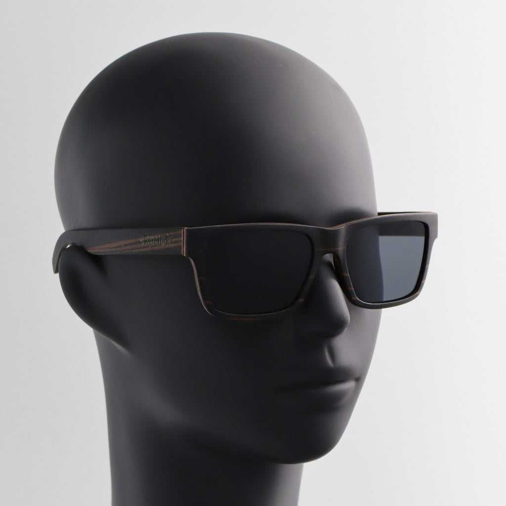 wooden sunglasses wayfarer style ebony wood smoke lenses on black male mannequin head eKodoKi METRO