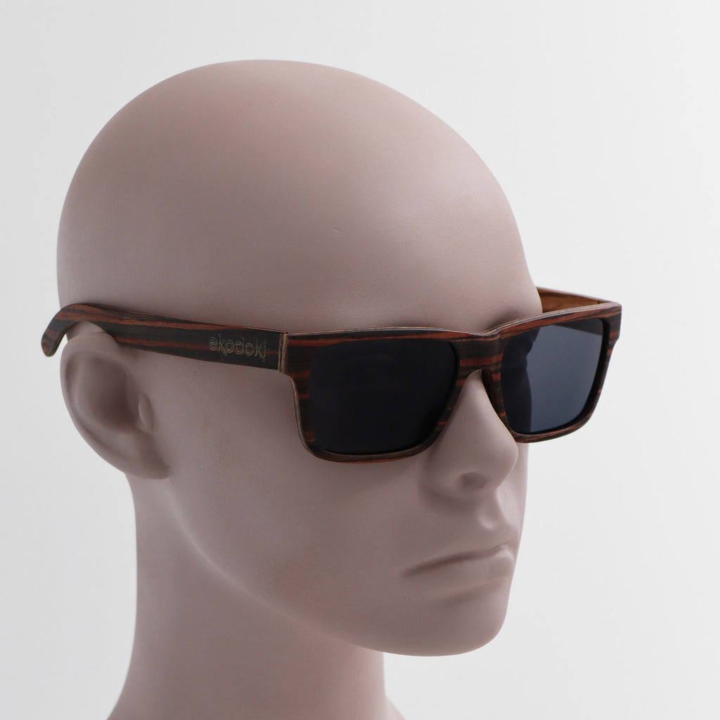 wooden sunglasses wayfarer style striped ebony wood smoke lenses on tan male mannequin head eKodoKi METRO